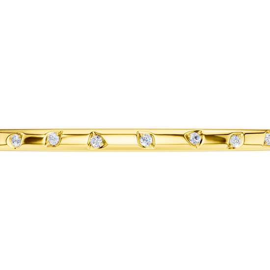 A substantial, high-polish 14k yellow gold wide cuff from the Amorati Fourteen Collection, featuring scattered star and geometric insets with shimmering round lab-grown diamonds.
