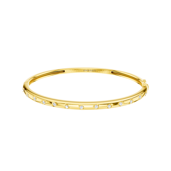 A substantial, high-polish 14k yellow gold wide cuff from the Amorati Fourteen Collection, featuring scattered star and geometric insets with shimmering round lab-grown diamonds.