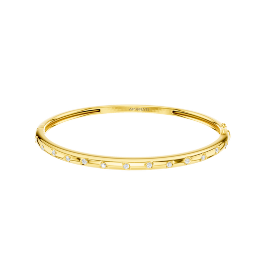 A substantial, high-polish 14k yellow gold wide cuff from the Amorati Fourteen Collection, featuring scattered star and geometric insets with shimmering round lab-grown diamonds.
