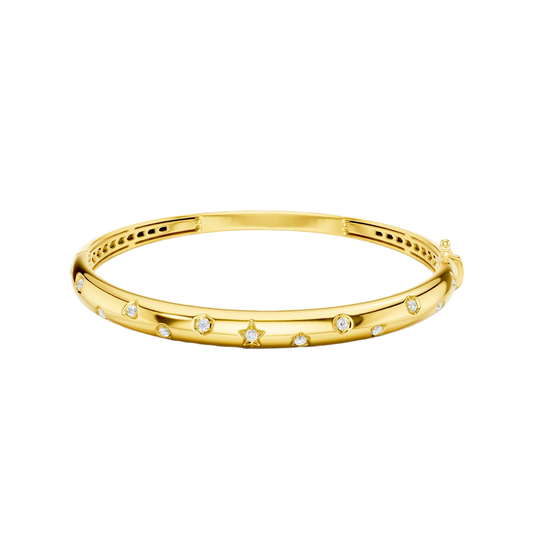 A bold, high-polish 14k yellow gold statement bangle by Amorati featuring scattered star and geometric insets with shimmering round-cut lab-grown diamonds. Amorati’s signature F O U R T E E N T H Collection