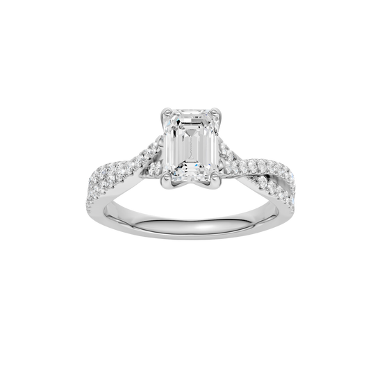 A top view of 14K white gold Amorati Vignette emerald diamond solitaire with prong setting and diamond band