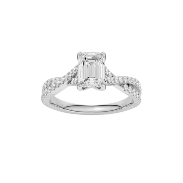 A top view of 14K white gold Amorati Vignette emerald diamond solitaire with prong setting and diamond band