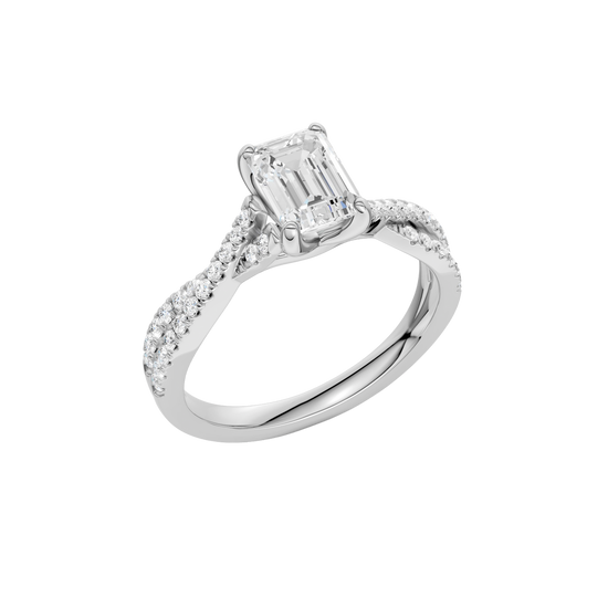 An angled view of 14K white gold Amorati Vignette emerald diamond solitaire with prong setting and diamond band