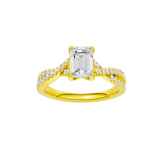 A top view of 14K yellow gold Amorati Vignette emerald diamond solitaire with prong setting and diamond band