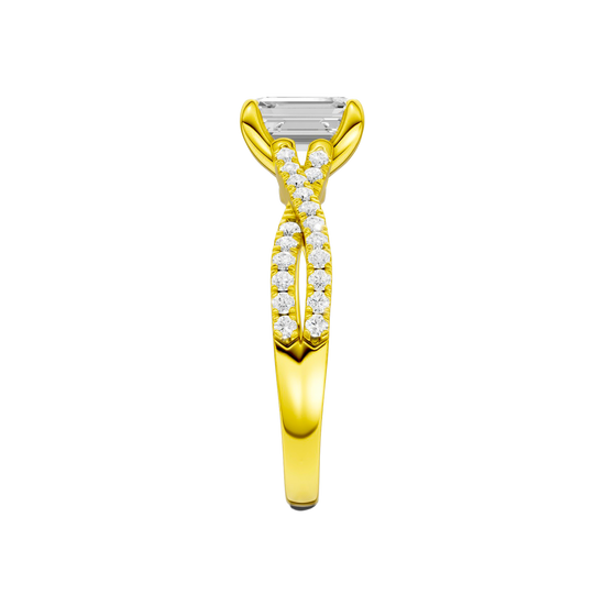 A side view of 14K yellow gold Amorati Vignette emerald diamond solitaire with prong setting and diamond band