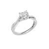 An angled view of 14K white gold Amorati Vignette heart diamond solitaire with prong setting and diamond band