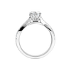 A side profile view of 14K white gold Amorati Vignette heart diamond solitaire with prong setting and diamond band