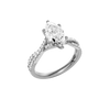 Angled view of the Marquise cut diamond engagement ring in 14k white gold with a prong diamond band and twist setting