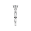 A side view of 14K white gold Amorati Vignette oval diamond solitaire with prong setting and diamond band