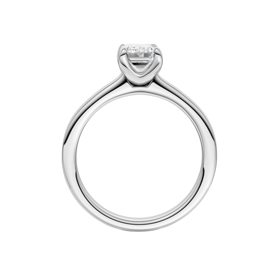 A profile view of the Emerald cut diamond engagement ring in platinum with a plain band and solitaire setting
