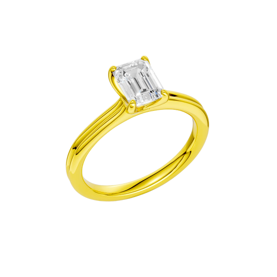 An angled view of the Emerald cut diamond engagement ring in 14k yellow gold with a plain band and solitaire setting
