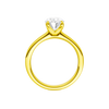 A profile view of the Oval cut diamond engagement ring in 14k yellow gold with a plain band and solitaire setting