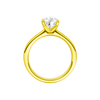 A profile view of the Pear cut diamond engagement ring in 14k yellow gold with a plain band and solitaire setting