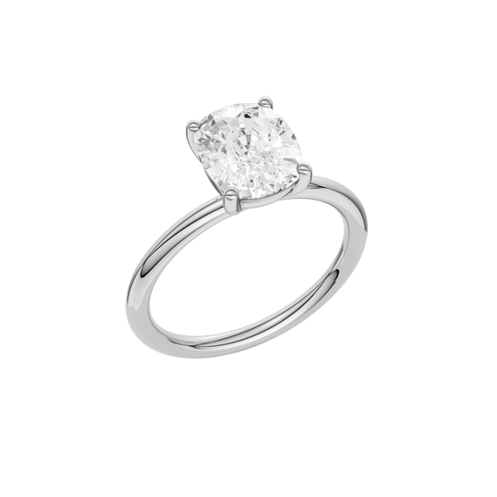 Angled view of the Elongated cushion cut diamond engagement ring in 14k white gold with a plain band and solitaire setting