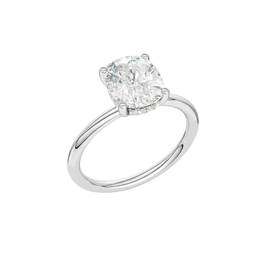 A three-quarter view of the Elongated cushion cut diamond engagement ring in platinum with a plain band and solitaire setting