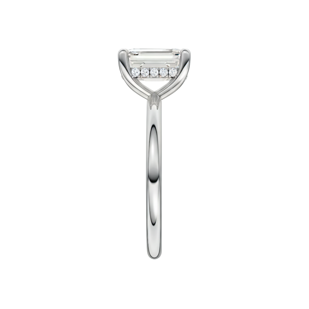 A side view of the Emerald cut diamond engagement ring in 14k white gold with a plain band and solitaire setting