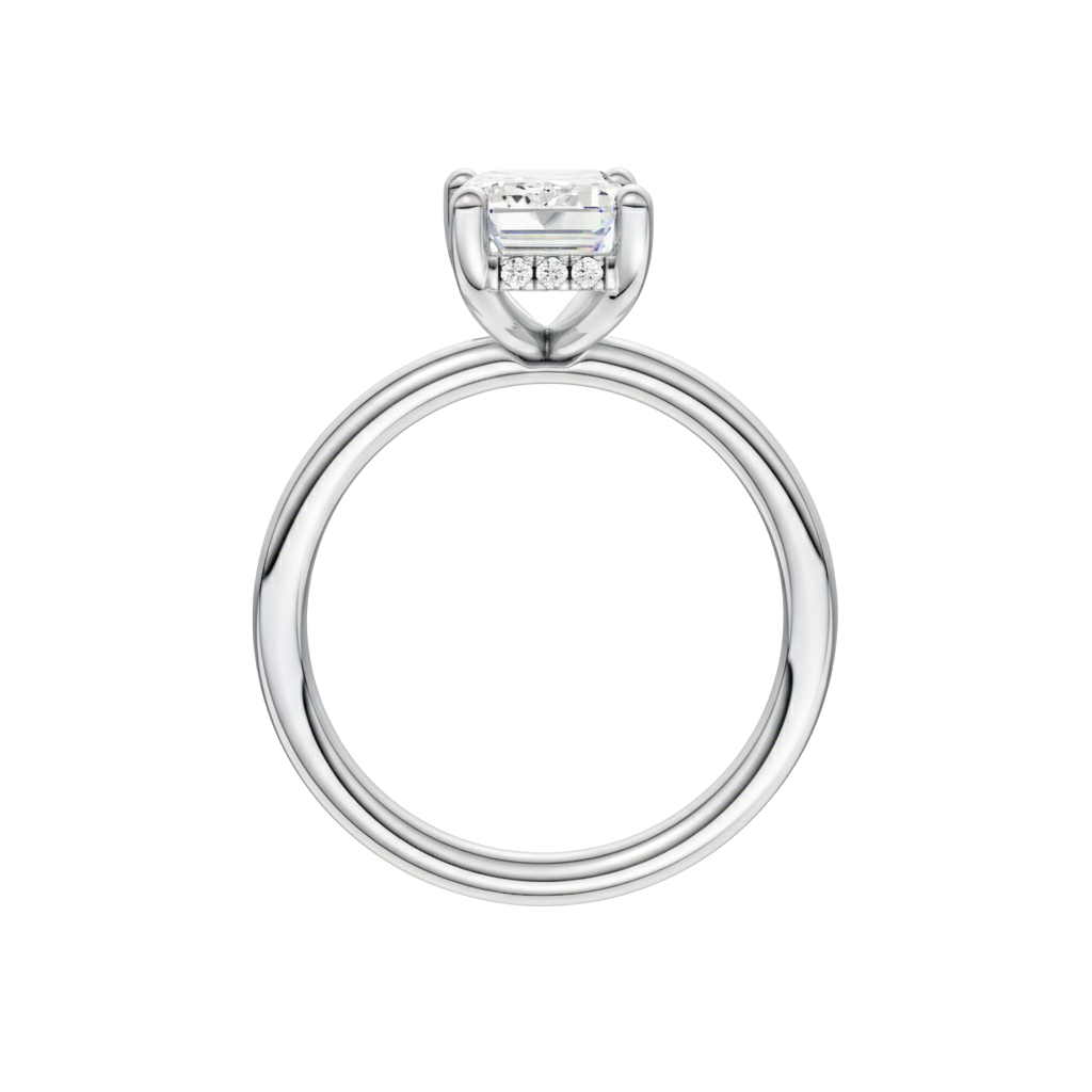 A profile view of the Emerald cut diamond engagement ring in 14k white gold with a plain band and solitaire setting