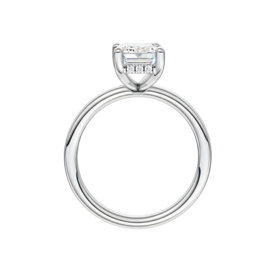 A profile view of the Emerald cut diamond engagement ring in platinum with a plain band and solitaire setting