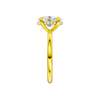 A side view of the Oval cut diamond engagement ring in 14k yellow gold with a plain band and solitaire setting