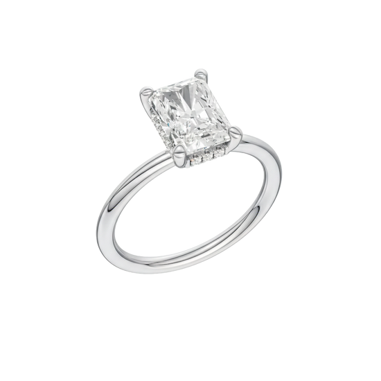 A three-quarter view of the Radiant cut diamond engagement ring in platinum with a plain band and solitaire setting