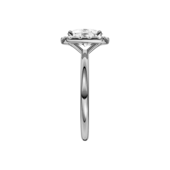 A side on view of the elongated cushion cut diamond engagement ring in 14k white gold with a plain band and solitaire setting