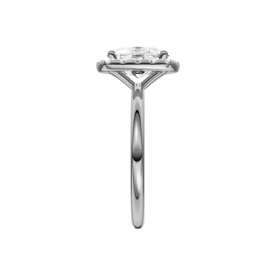 A side on view of the elongated cushion cut diamond engagement ring in platinum with a plain band and solitaire setting