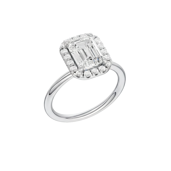 A three-quarter view of the Emerald cut diamond engagement ring in 14k white gold with a plain band and solitaire setting