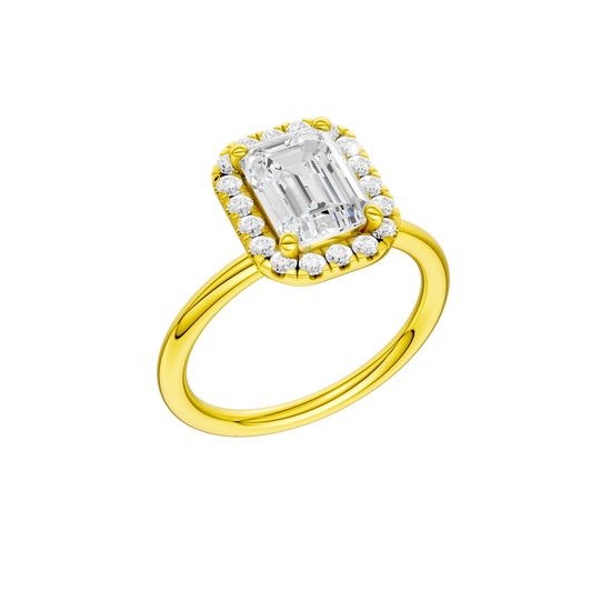 A three-quarter view of the Emerald cut diamond engagement ring in 14k yellow gold with a plain band and solitaire setting