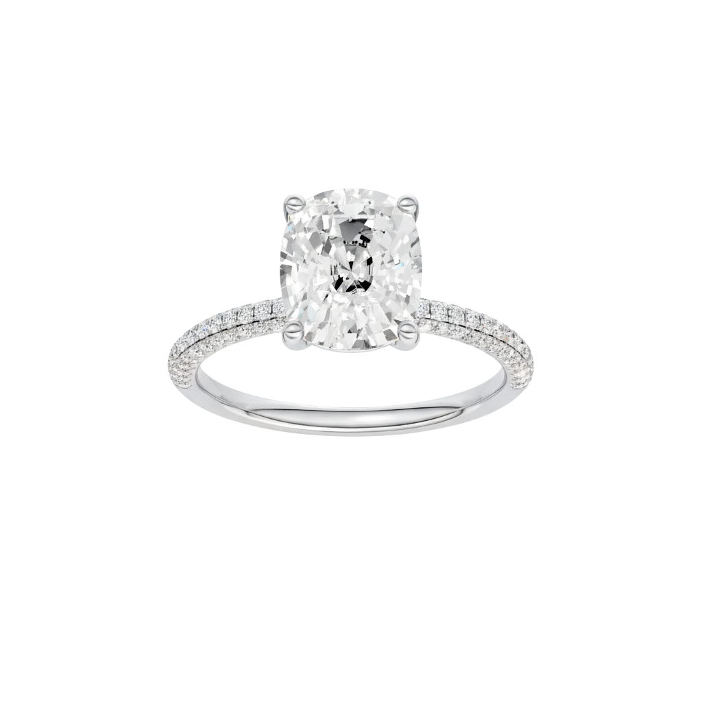 A front view of the Elongated Cushion cut diamond engagement ring in platinum with a pavé diamond band and cathedral setting
