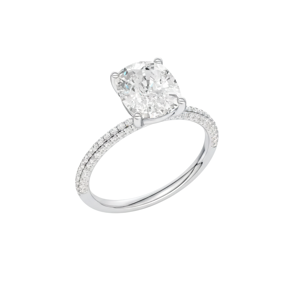 A profile view of the Elongated Cushion cut diamond engagement ring in platinum with a pavé diamond band and cathedral setting