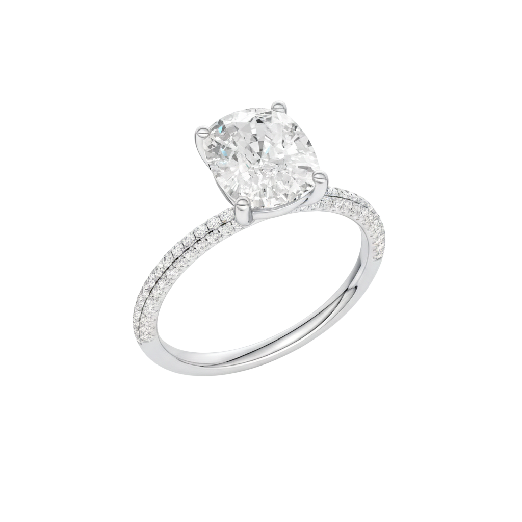 A three-quarter view of the Elongated Cushion cut diamond engagement ring in 14k white gold with a pavé diamond band and cathedral setting