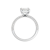 A profile view of the Emerald cut diamond engagement ring in platinum with a pavé diamond band and cathedral setting
