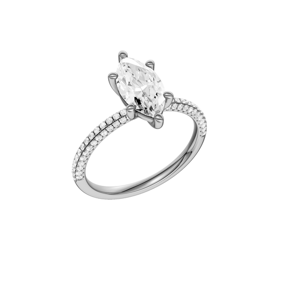 A three-quarter view of the Marquise cut diamond engagement ring in 14k white gold with a pavé diamond band and cathedral setting