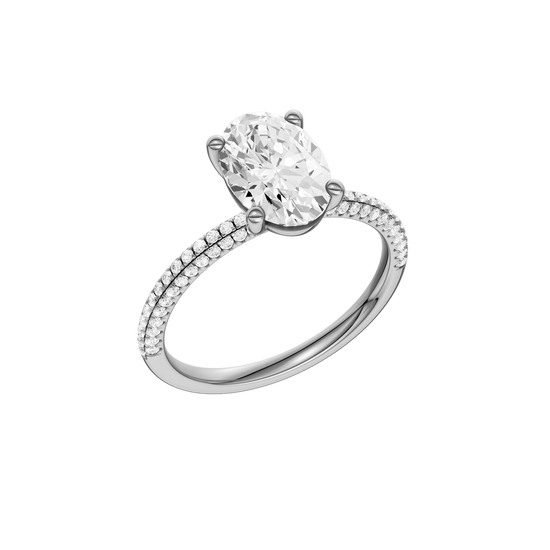 A three-quarter view of the oval cut diamond engagement ring in platinum with a pavé diamond band and cathedral setting