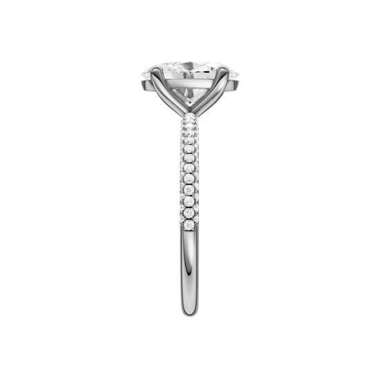 A side view of the oval cut diamond engagement ring in 14k white gold with a pavé diamond band and cathedral setting