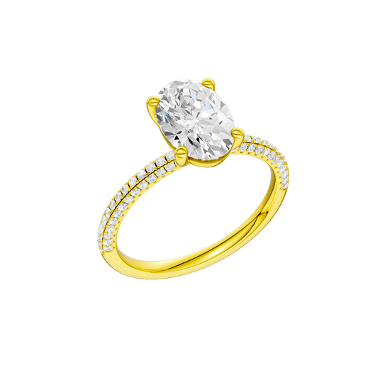 A three-quarter view of the oval cut diamond engagement ring in 14k yellow gold with a pavé diamond band and cathedral setting