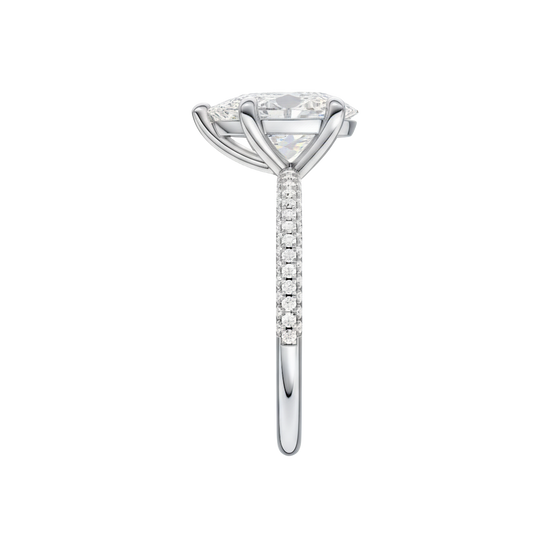 A side view of the Pear cut diamond engagement ring in 14k white gold with a pavé diamond band and cathedral setting