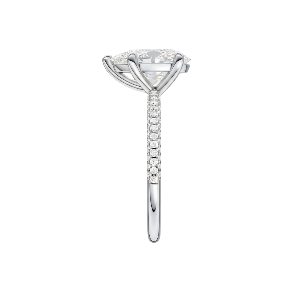 A side view of the Pear cut diamond engagement ring in 14k white gold with a pavé diamond band and cathedral setting