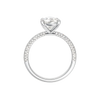 A profile view of the Pear cut diamond engagement ring in 14k white gold with a pavé diamond band and cathedral setting