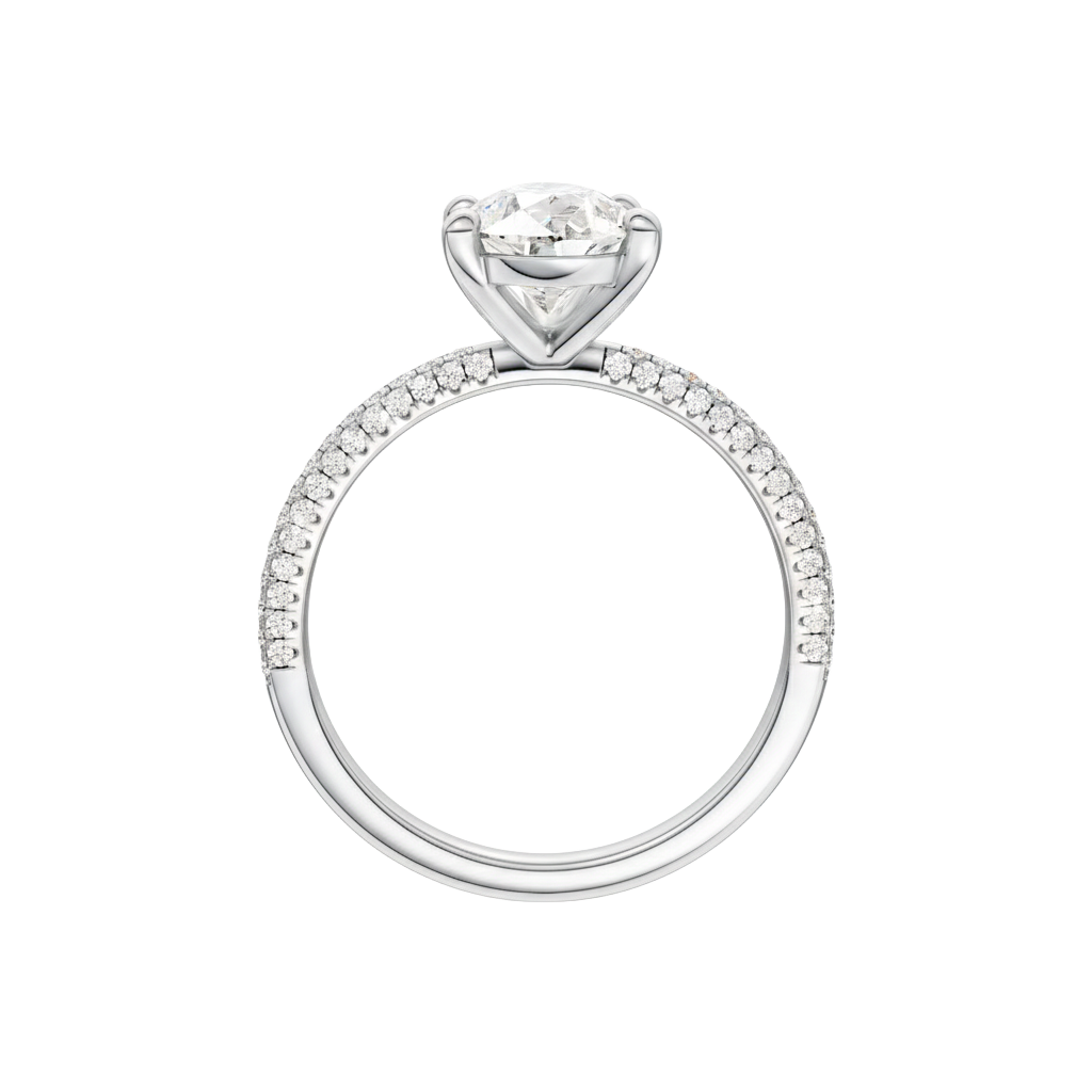 A profile view of the Pear cut diamond engagement ring in 14k white gold with a pavé diamond band and cathedral setting