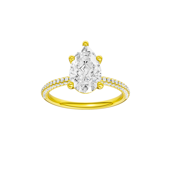 A front view of the Pear cut diamond engagement ring in 14k yellow gold with a pavé diamond band and cathedral setting