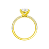A profile view of the Pear cut diamond engagement ring in 14k yellow gold with a pavé diamond band and cathedral setting