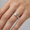 Princess cut diamond engagement ring in 14k white gold with a pavé diamond band and cathedral setting on a hand