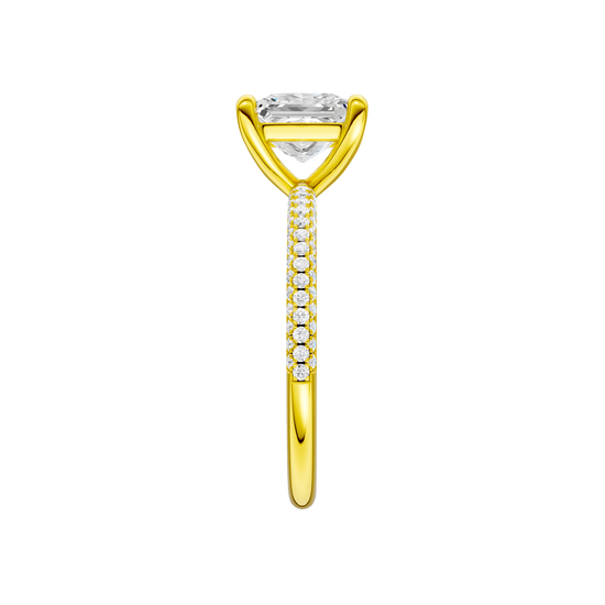 A side view of the Princess cut diamond engagement ring in 14k yellow gold with a pavé diamond band and cathedral setting