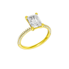 An angled view of 14K yellow gold Amorati Alight radiant diamond solitaire with cathedral setting and pavé band