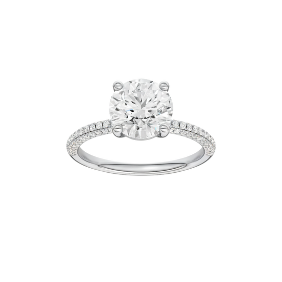 A front view of the Round cut diamond engagement ring in platinum with a pavé diamond band and cathedral setting