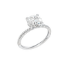 A three-quarter view of the Round cut diamond engagement ring in 14k white gold with a pavé diamond band and cathedral setting