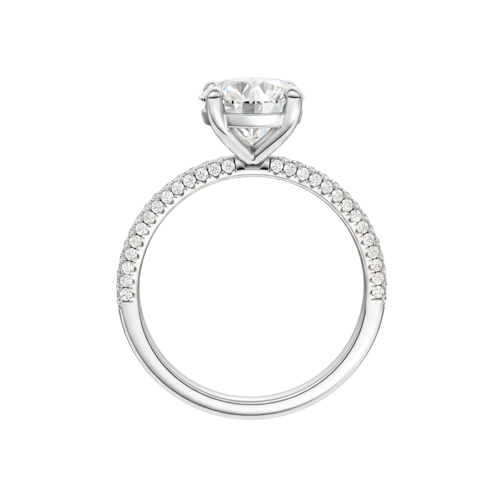 A profile view of the Round cut diamond engagement ring in platinum  with a pavé diamond band and cathedral setting