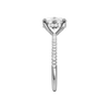 A side view of the Elongated cushion cut diamond engagement ring in platinum with a pavé diamond band and cathedral setting