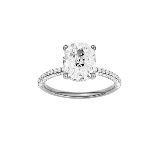 A front view of the Elongated cushion cut diamond engagement ring in platinum with a pavé diamond band and cathedral setting